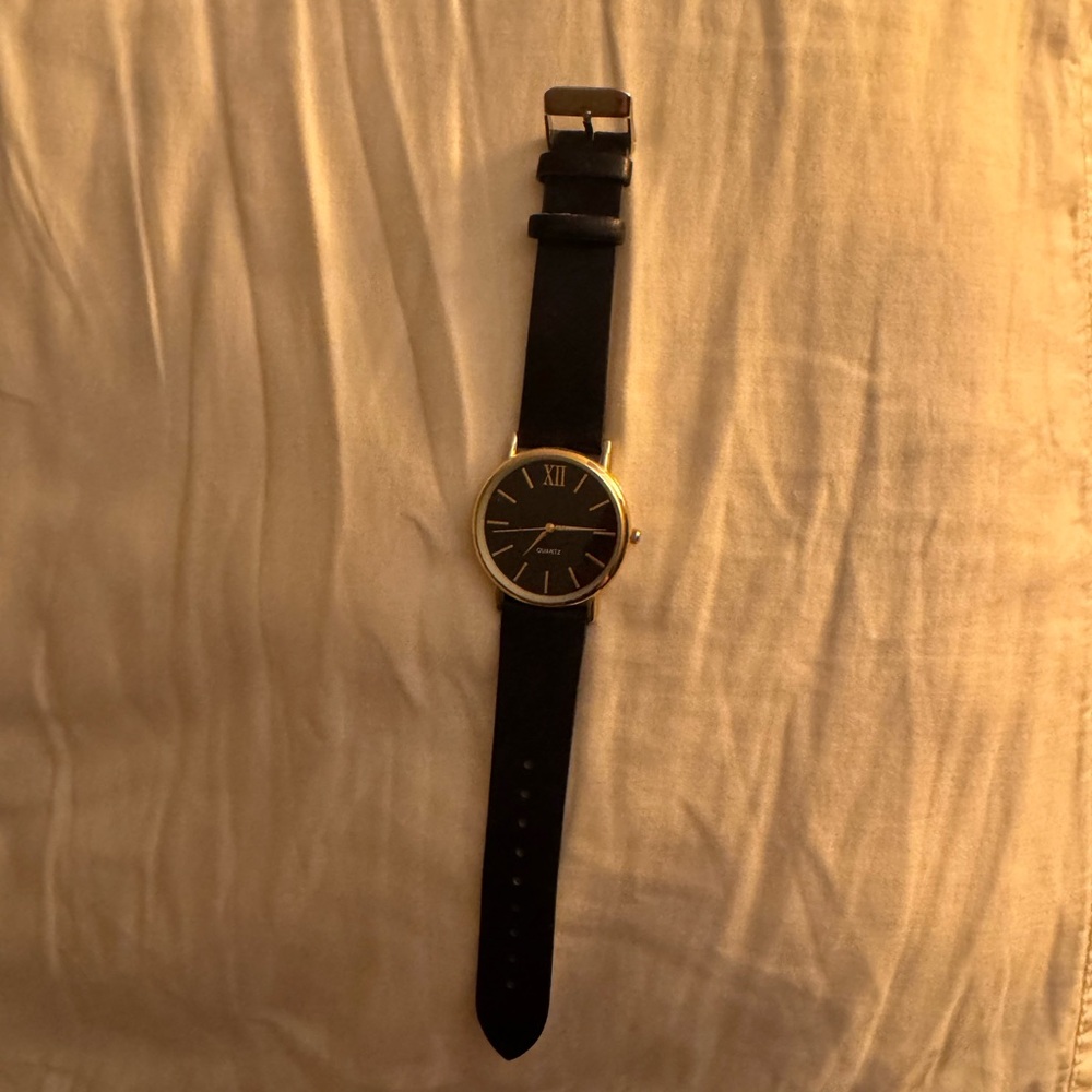 Black Leather Strap Watch with Gold Accents
